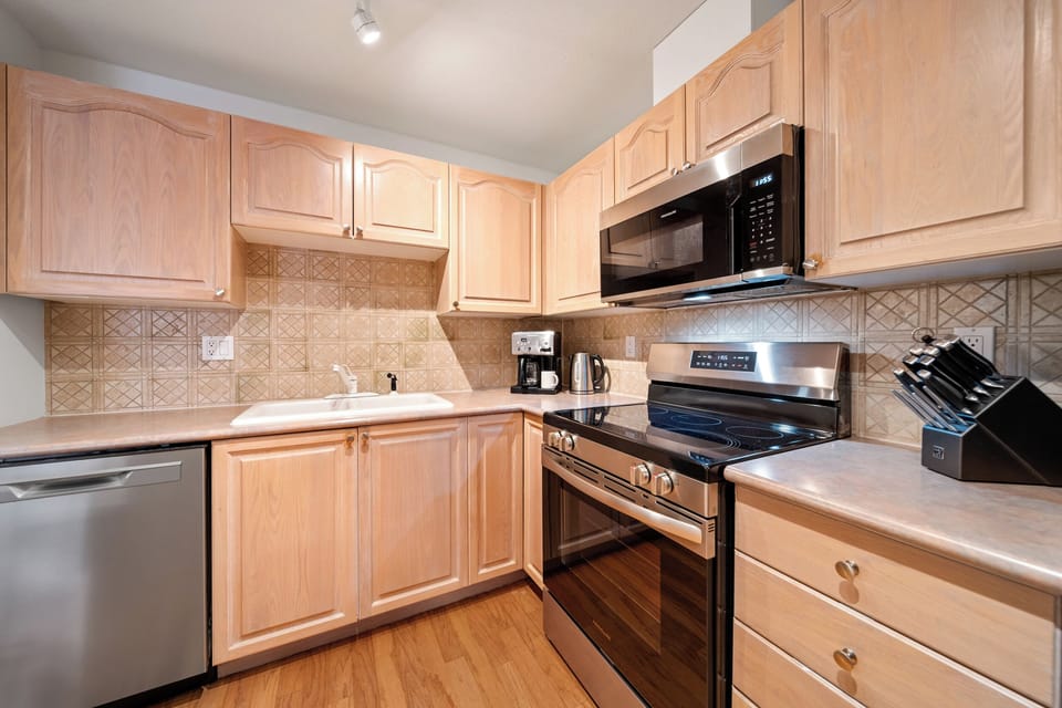 The kitchen features ample counter space for comfortable meal cooking. 