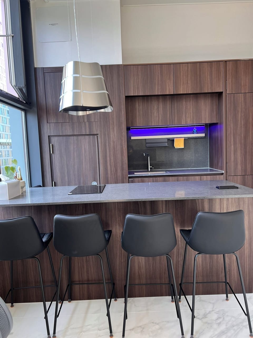 a table for four and a cooktop