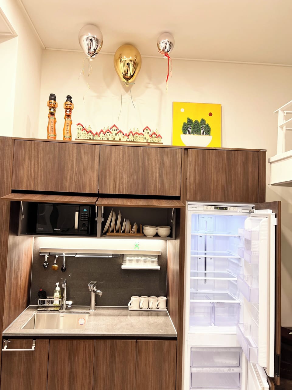 Samsung refrigerator, LG water purifier, microwave, bowl