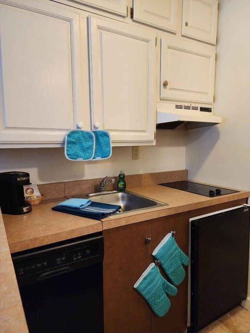 Kitchenette complete with Refrigerator, Stovetop, Dishwasher, Keurig, Airfryer, and all cooking utensils..