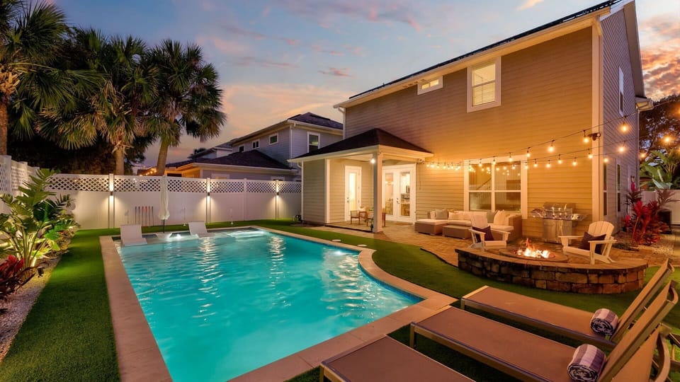 Cool off in the pool, challenge your friends to a round of putt-putt, and end the day with a fire – this backyard is pure bliss.