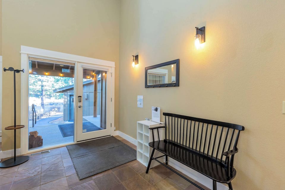 Entry way with lots of storage for coats and shoes. 