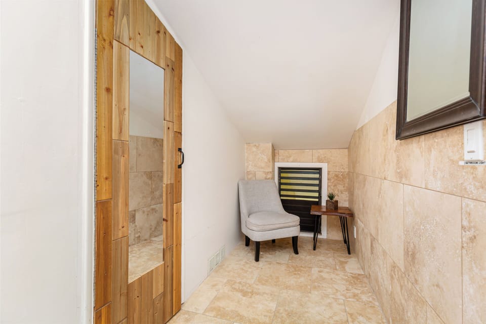Corner in the loft and door to the bathroom
