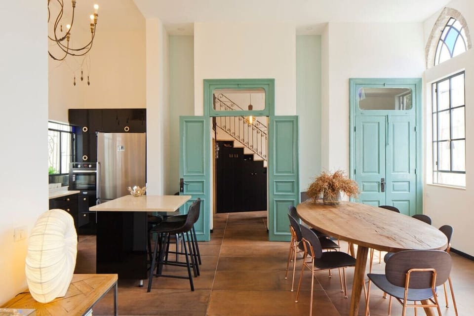 Dining area, kitchen area and path way to the stairs