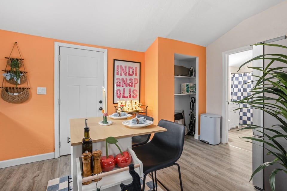 A bathroom is nearby the kitchen