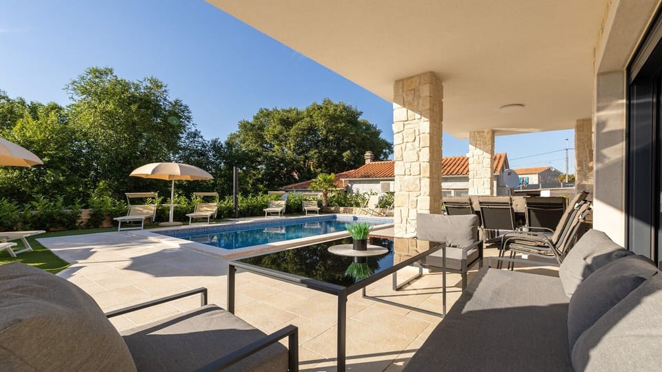 Lounge area and outdoor dining area of Villa Laura