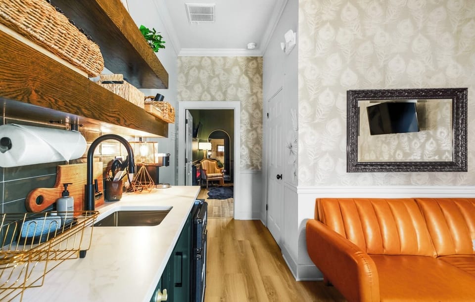 Tiny kitchen stocked with an airfyer.toaster oven,2 burner plug in stove, Keurig, fridge and blender