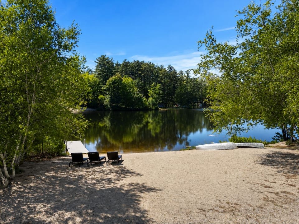 The beach with lounging chairs. Nice and sandy and gradual decline (perfect for kids)
