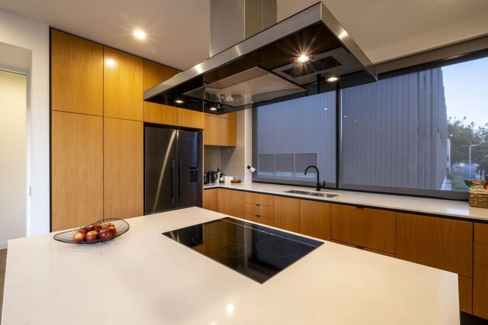 Whip up your morning coffee while you watch the city wake up through your floor-to-ceiling windows—this kitchen is built for both.
