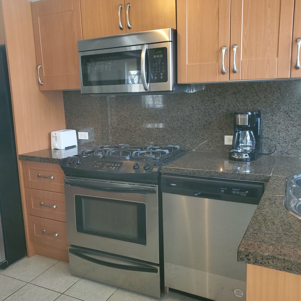 fully stocked kitchen with gas stove