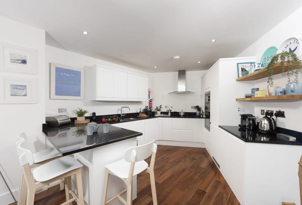 7 Whitehouse, Watergate Bay: The sleek kitchen is superbly equipped with everything you'll need during your stay