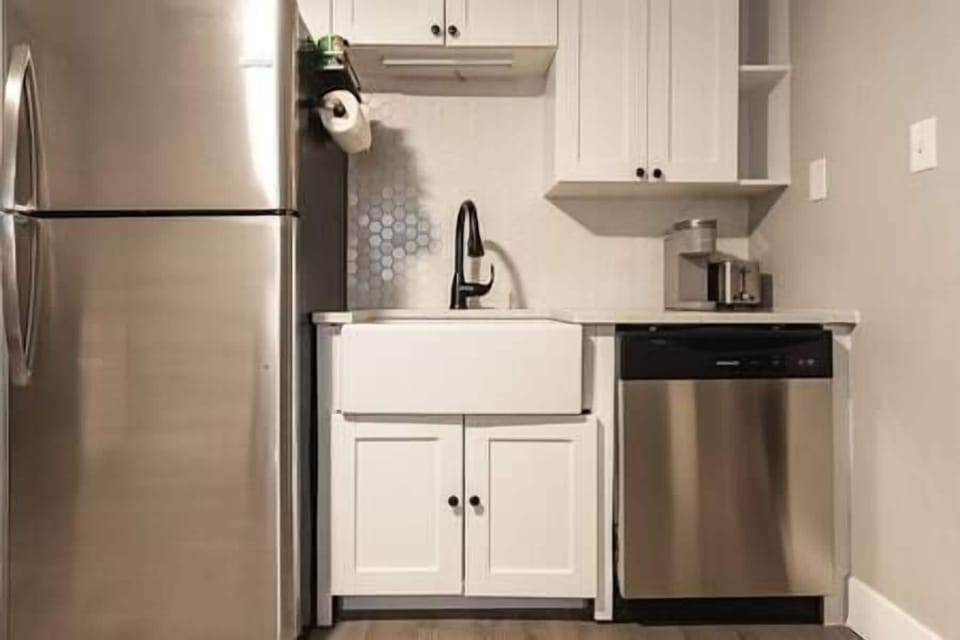 Farmhouse kitchen with full-sized refrigerator and dishwasher. Toaster and Keurig.