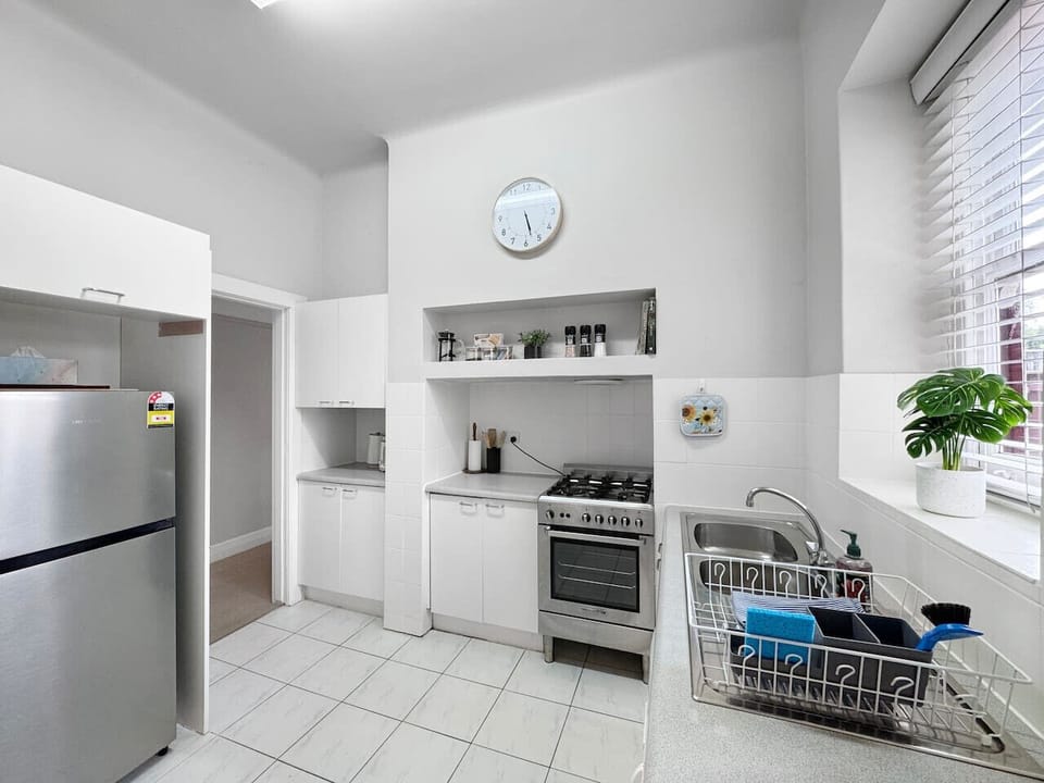 Well appointed kitchen with stainless steel cooking & fridge