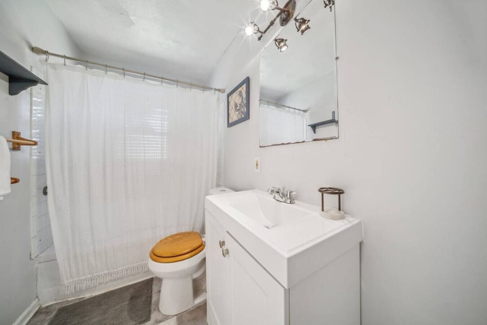 The bathroom is stocked with fresh towels and essential toiletries for your convenience.