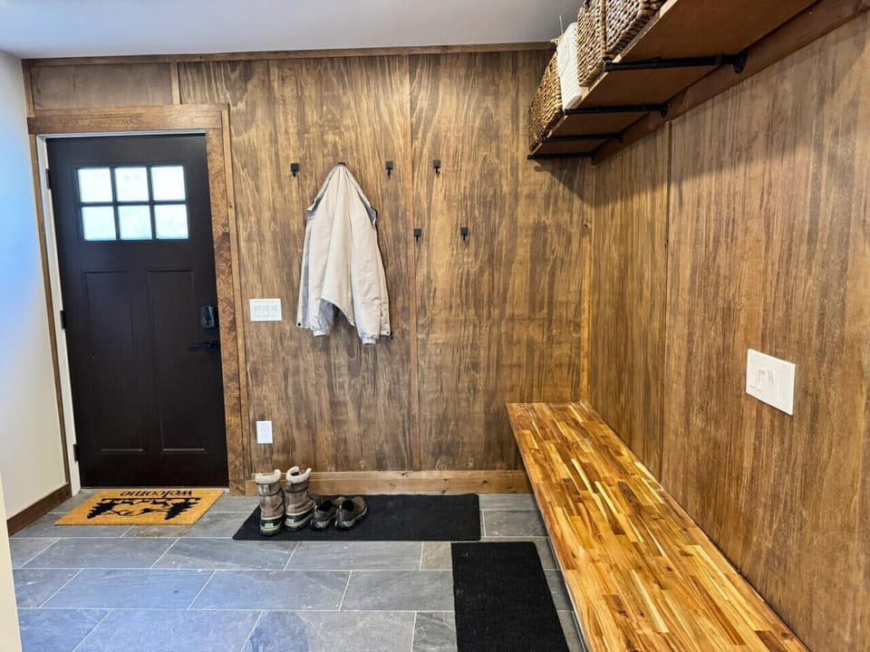 Huge mudroom with storage for boots, ski and clothing.