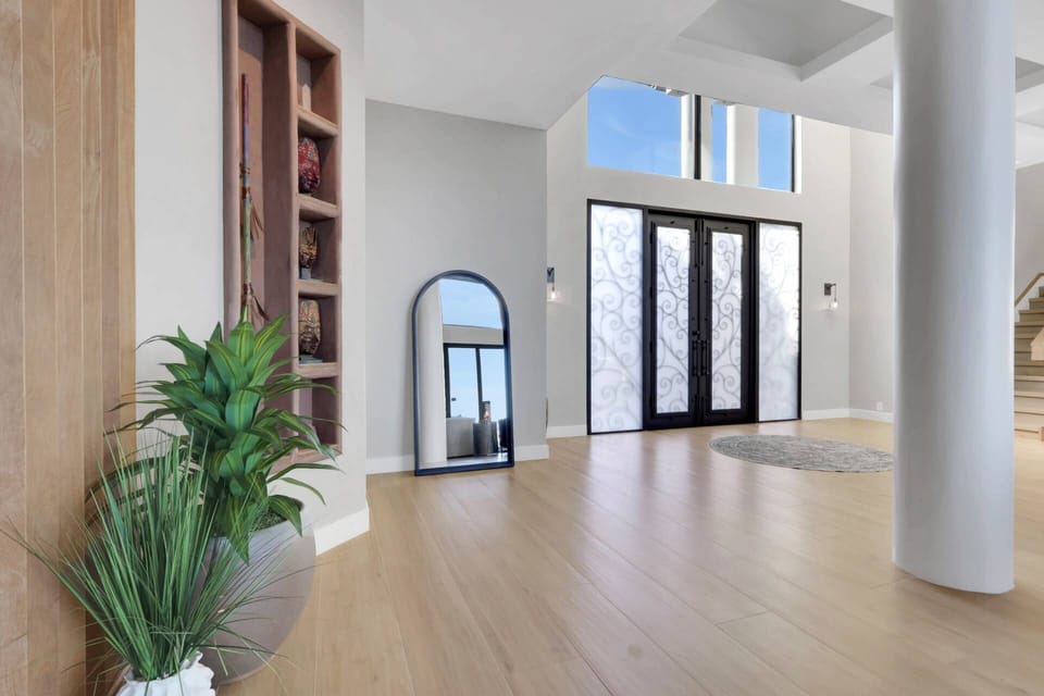 The home is filled with unique architectural details, adding interest every where you look; the open staircase leads you up to the second level.