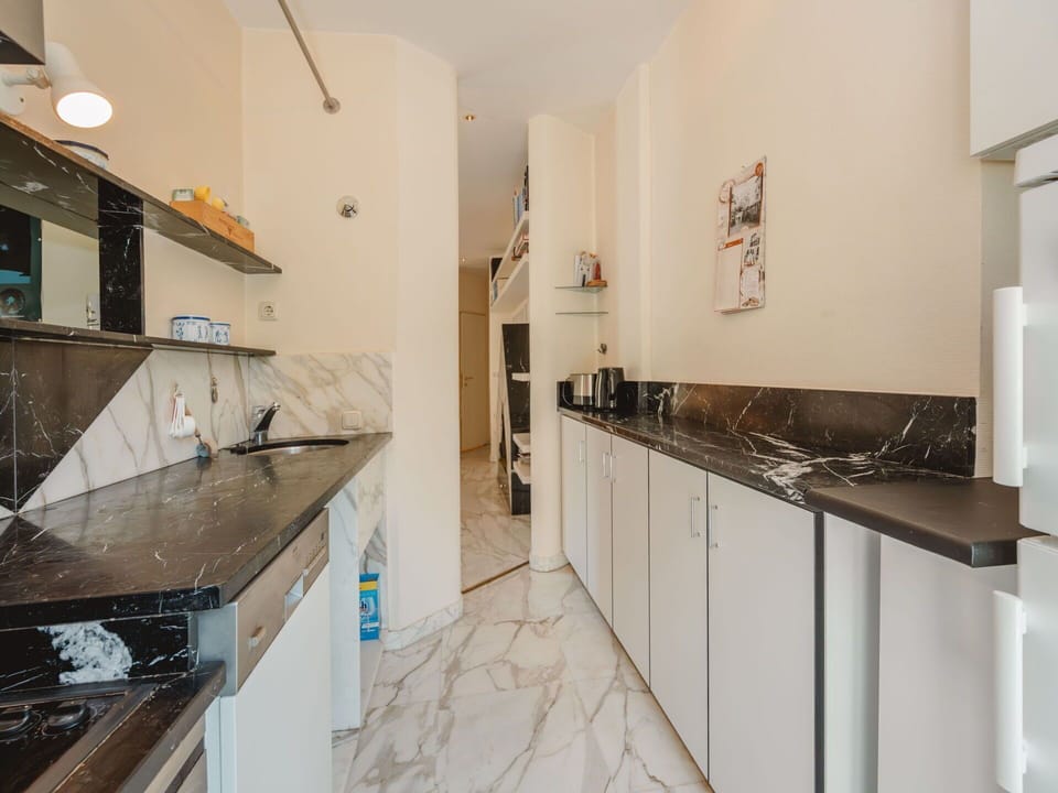 Flooring, Floor, Interior Design, Countertop, Kitchen, Apartment, Ceiling, Room, Cabinetry, Tile