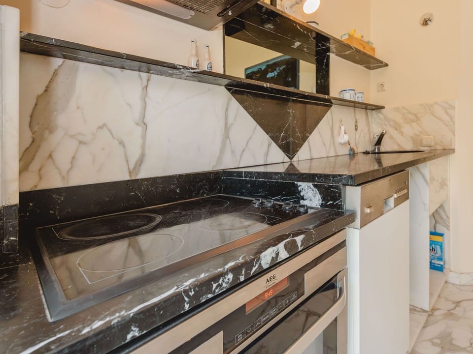 Kitchen, Countertop, Interior Design, Ceiling, Cabinetry, Kitchen Stove, Tile, Kitchen Appliance, Paint, Major Appliance