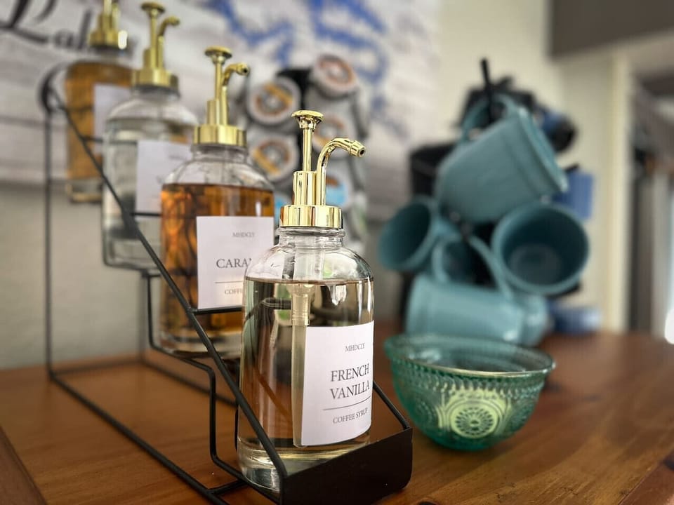 Customize your morning brew with our fully stocked coffee bar featuring a variety of flavors.