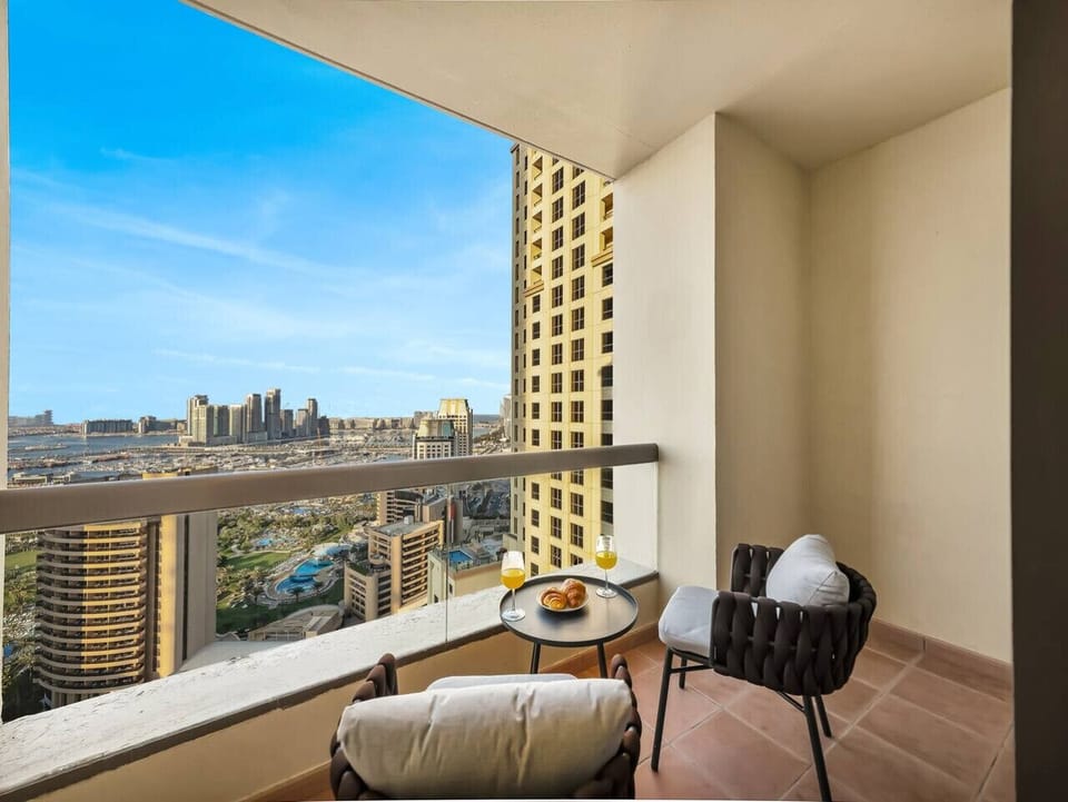 Relax and unwind in this serene balcony retreat, a perfect blend of comfort and scenery.