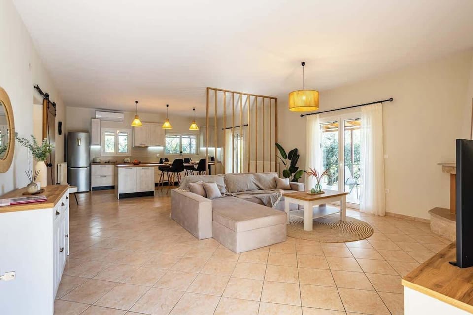 Spacious Living Room – Open layout with soft lighting and stylish décor, ideal for relaxation.