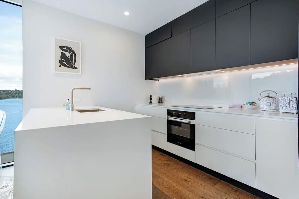 The kitchen has a cooktop, oven, microwave, toaster, kettle and dishwasher.