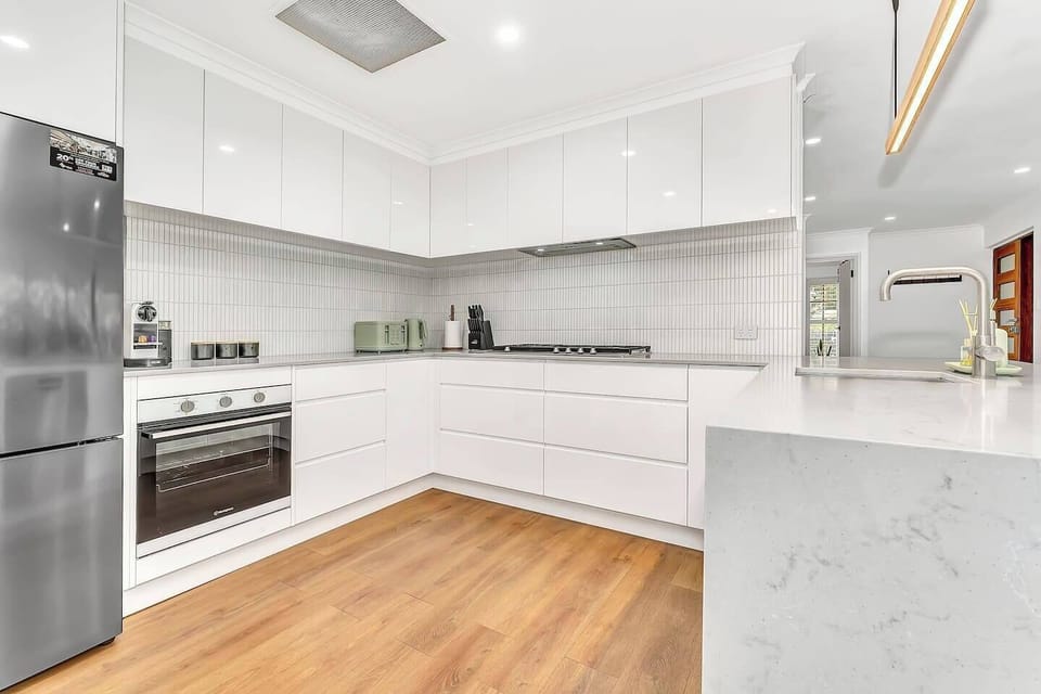 A sleek, fully equipped kitchen with modern appliances, ample storage, and a stylish design for effortless meal preparation.