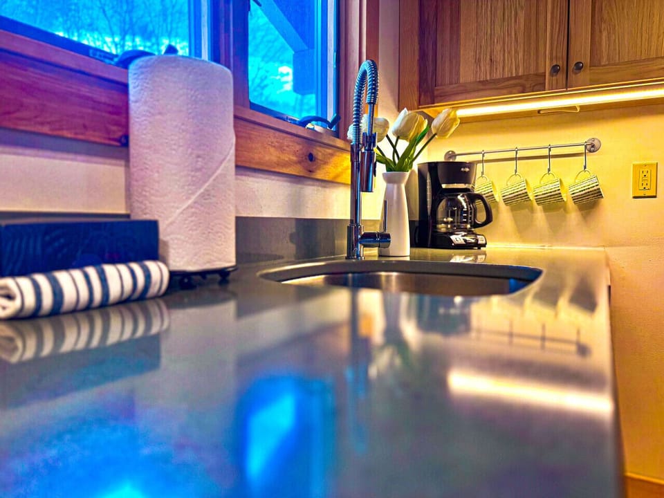 A clean and functional kitchen sink, perfect for all your meal prep needs.