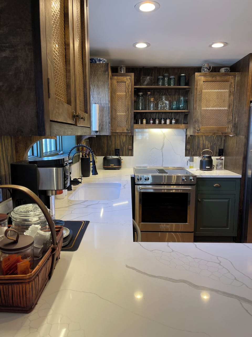Sink and electric oven range in kitchen