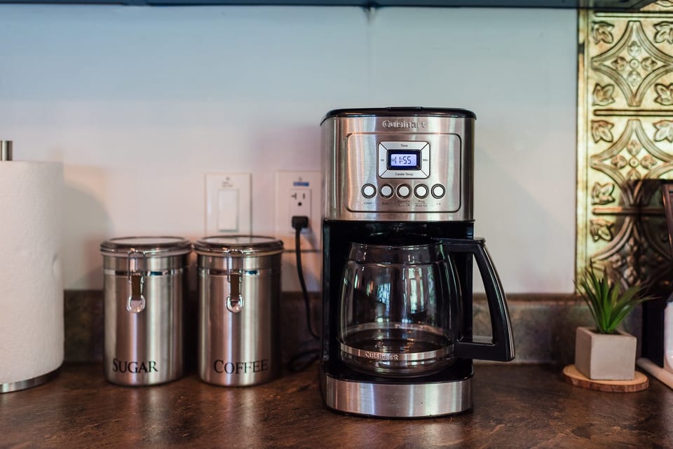 Drip coffee maker provided complete with coffee, cream, and sugar