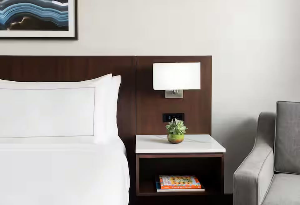 Enjoy bedside convenience with soft lighting and easy charging.
