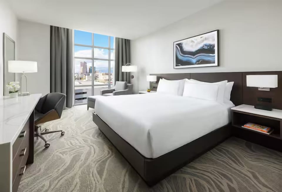 Unwind in a bright king room with city views.