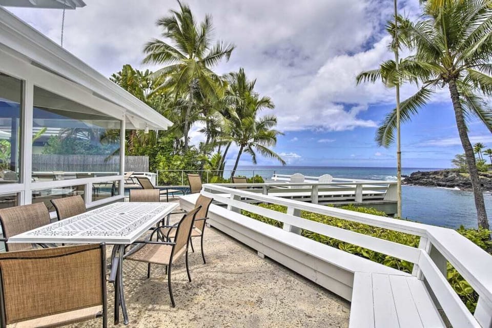 Outside Dining Area - Dining by the ocean's edge with umbrella covered table and BBQ