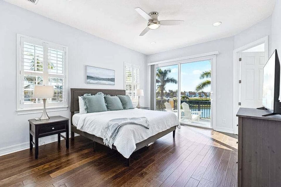 Master bedroom- Plush king bed and balcony access for a perfect morning.