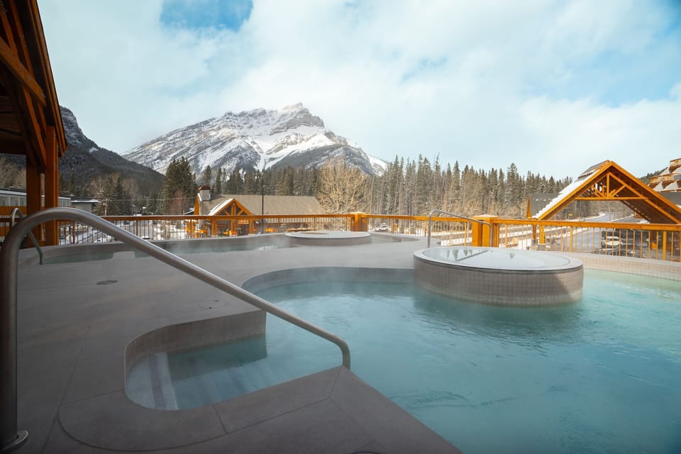 Soak in the hot tub with mountain views stretching out before you, steam rising against the cold alpine air.