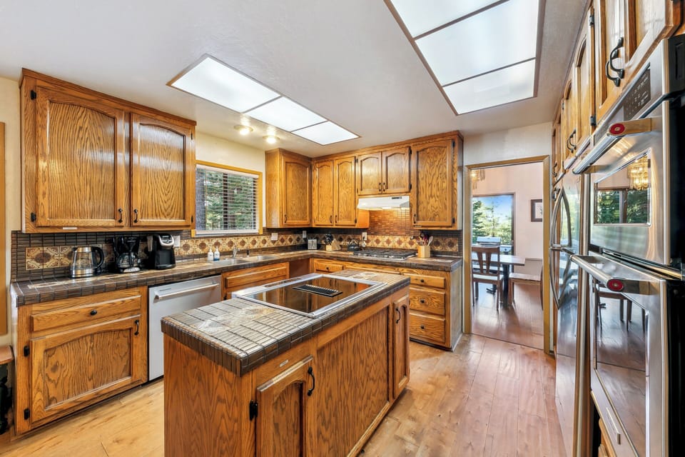 The kitchen is fully stocked with cook and dishware for a family of 10