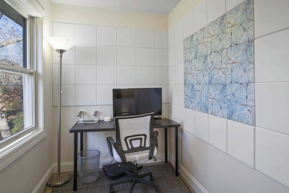 Dedicated area with desk, desk chair and computer monitor