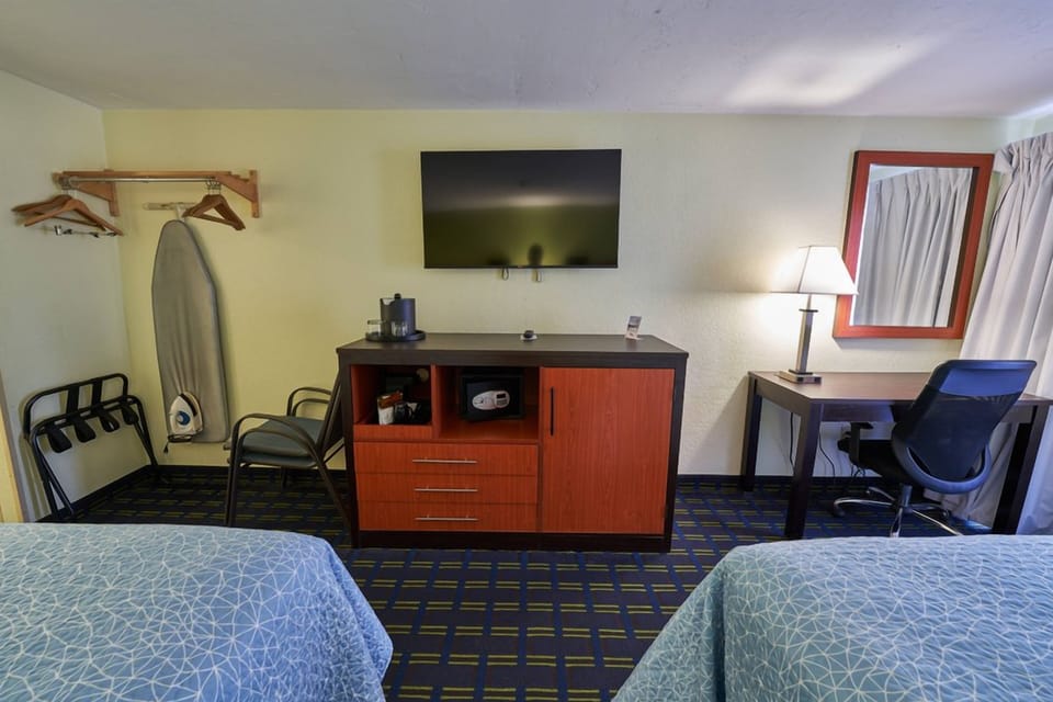 Settle in with a large TV, dresser, and easy seating.