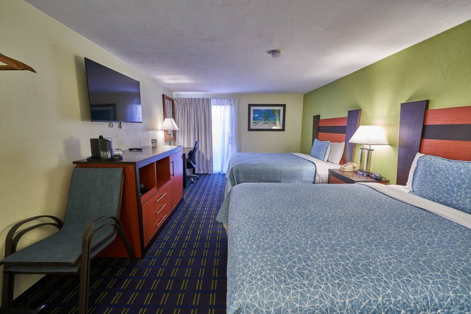 Stretch out in a spacious room with two comfy beds.