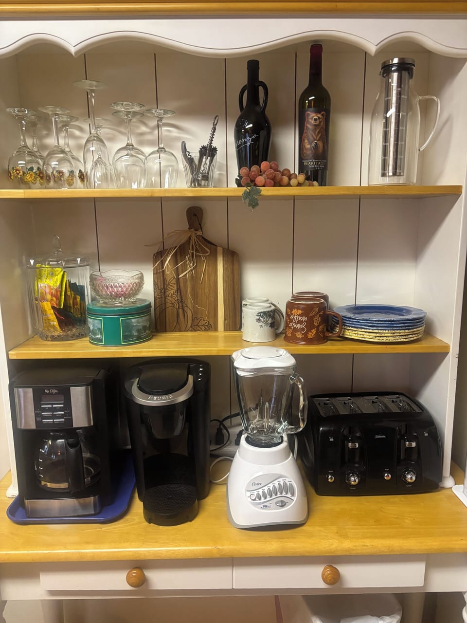 Hutch in Kitchen with Coffee makers, grinder, blender, toaster etc.