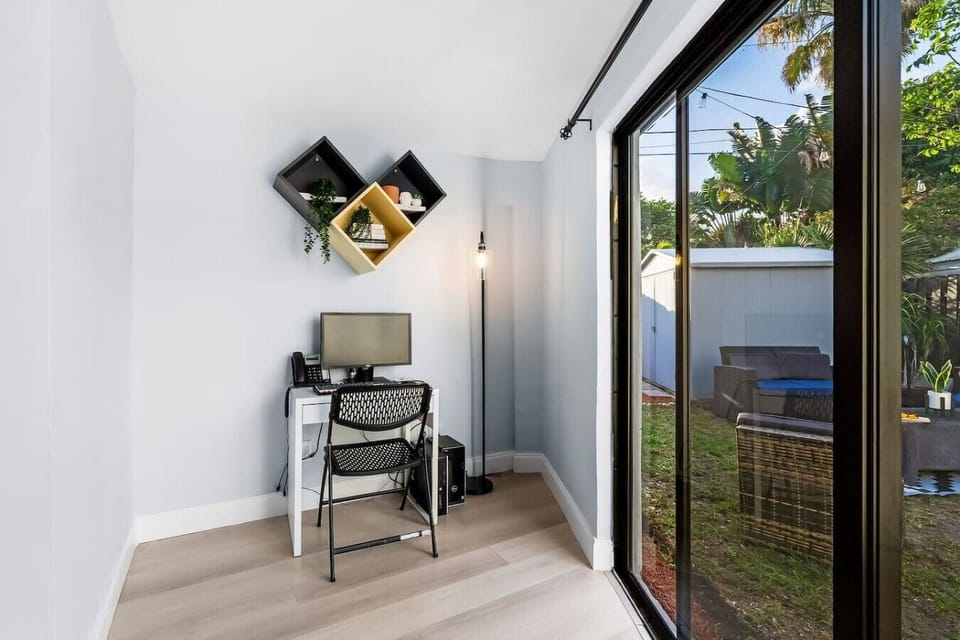 Dedicated workspace with desk and chair, ideal for remote work, digital nomads, business travelers, work-from-home stays, online meetings, laptop-friendly workspace, high-speed WiFi,
