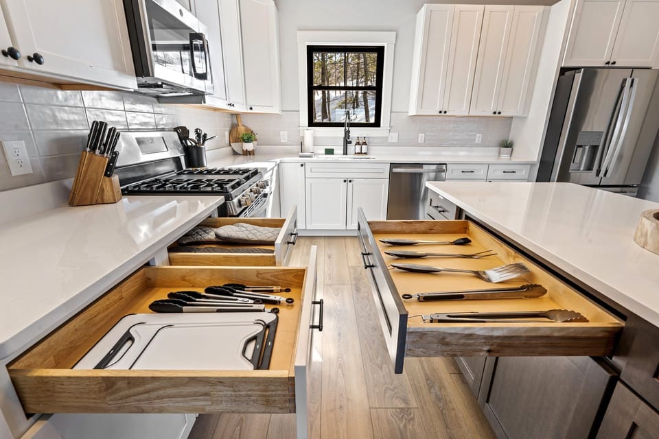 Fully stocked with pots, pans and plenty of dinnerware and silverware.