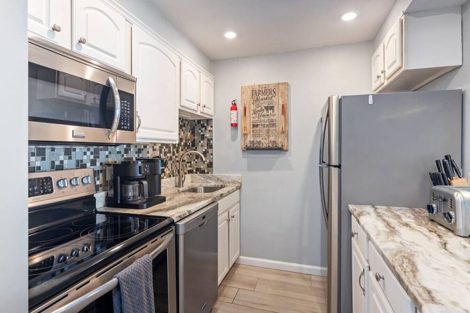 Whip up meals with ease in this well-appointed kitchen, complete with modern appliances and ample counter space.