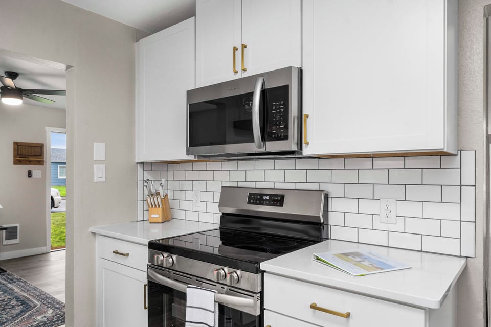 Brand new range and microwave in our fully stocked kitchen.