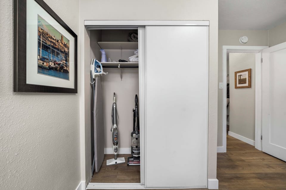 An iron, ironing board, clothes steamer, vacuum and extra linens provided.