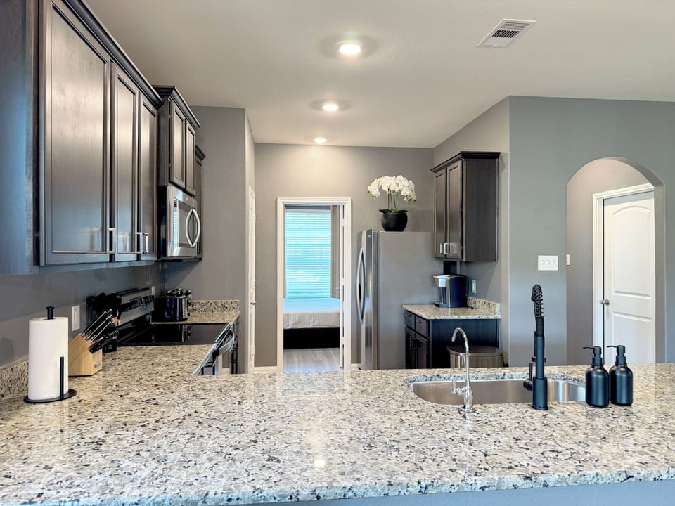 Fully stocked kitchen with stainless steel appliances