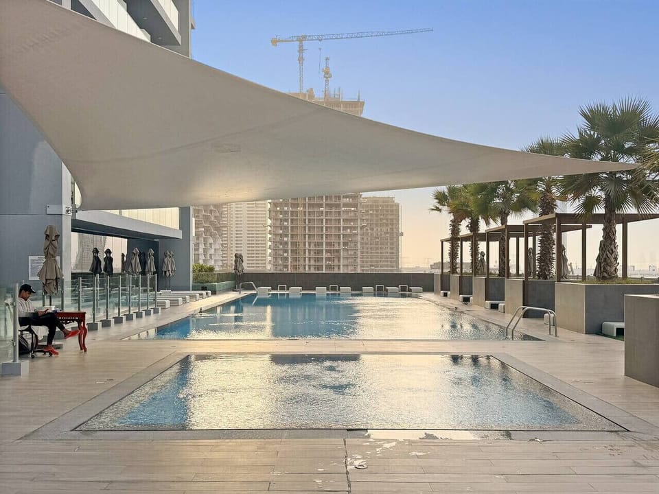 Pool Oasis: Dive into relaxation with stunning views and shaded lounging spots!