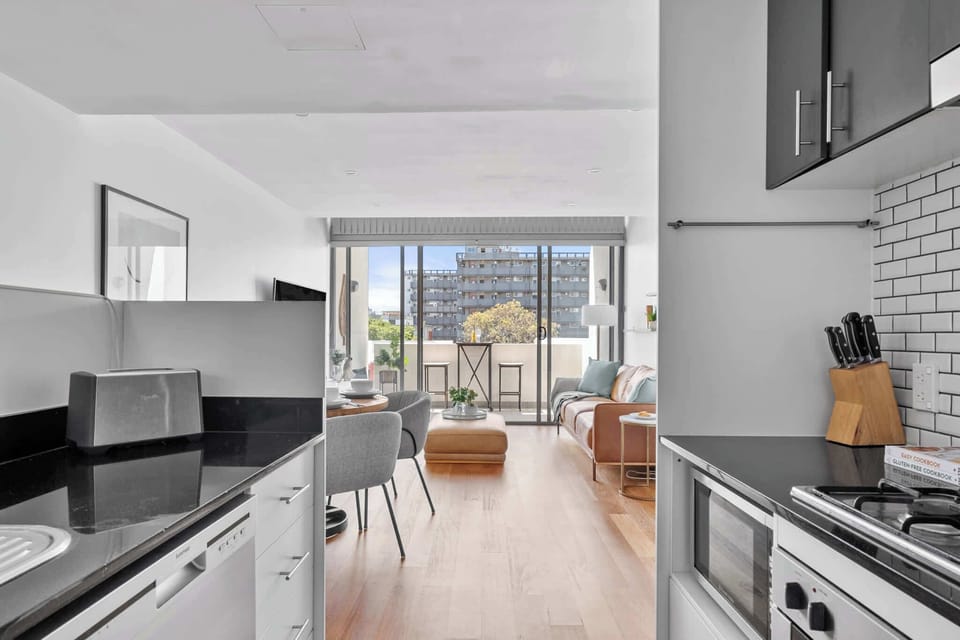 A seamless view from the kitchen to the lounge, creating an open and inviting space that blends cooking and relaxation effortlessly.