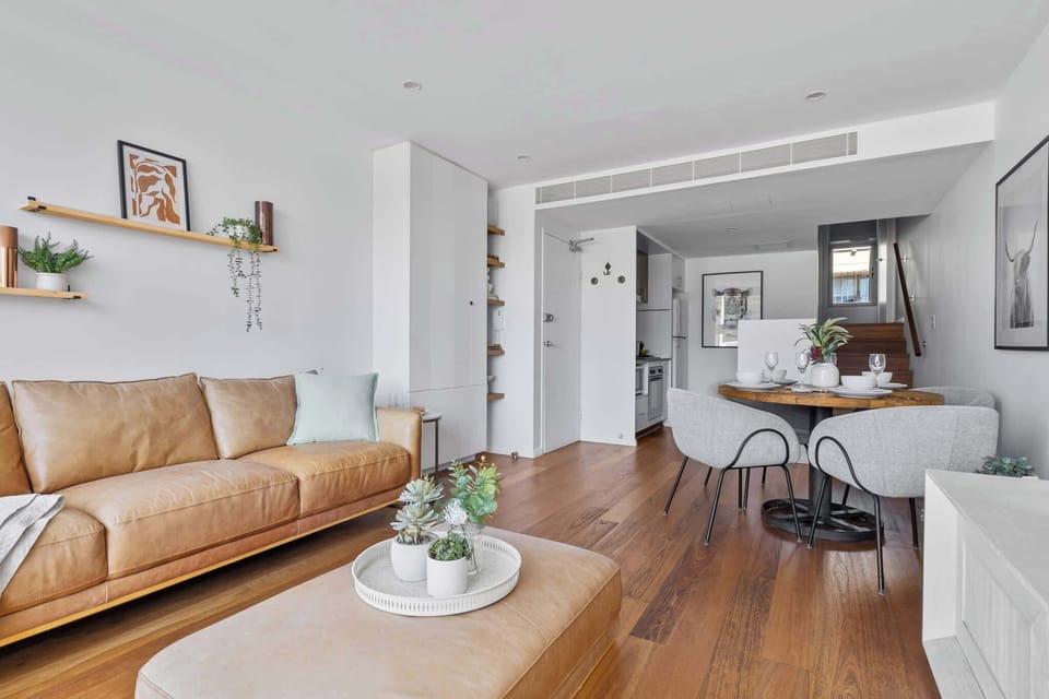 Elegant dining area with seating for up to four, seamlessly flowing into the cosy lounge for a relaxed and inviting atmosphere.