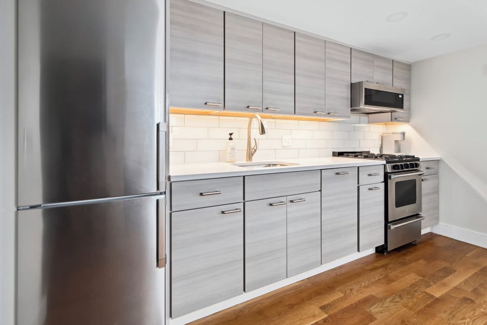 Updated kitchen with stainless steel appliances.